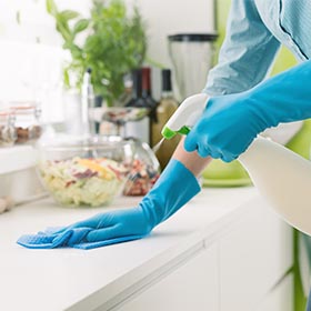 cleaning company in Nottingham, person cleaning kitchen counter top.