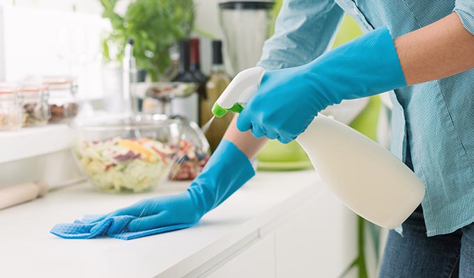 cleaning company in Nottingham, person cleaning a kitchen counter top.