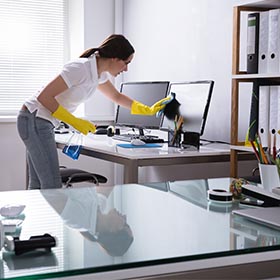 cleaning company in Nottingham, person cleaning an office computer